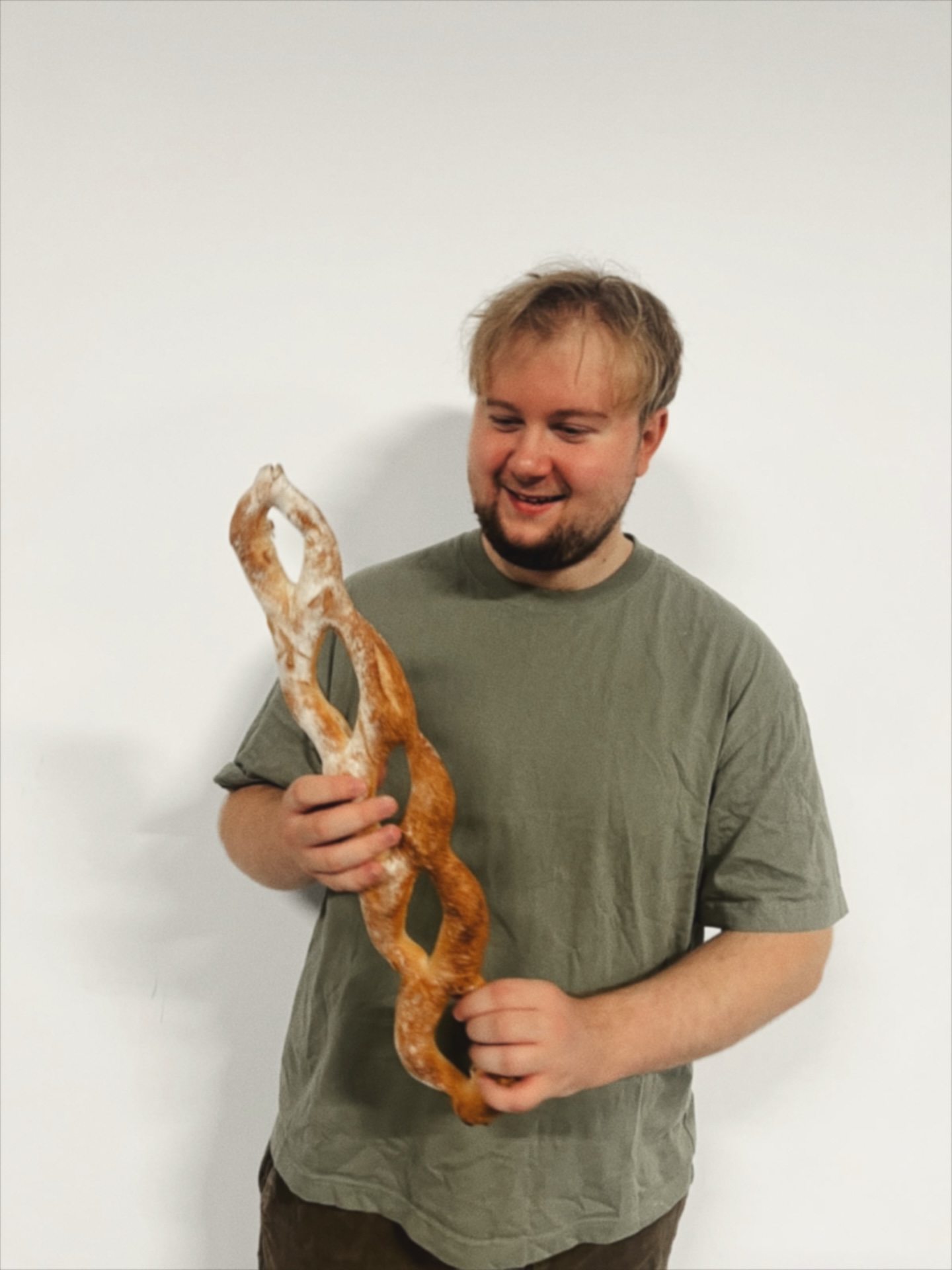 Aronas holding a loaf of bread